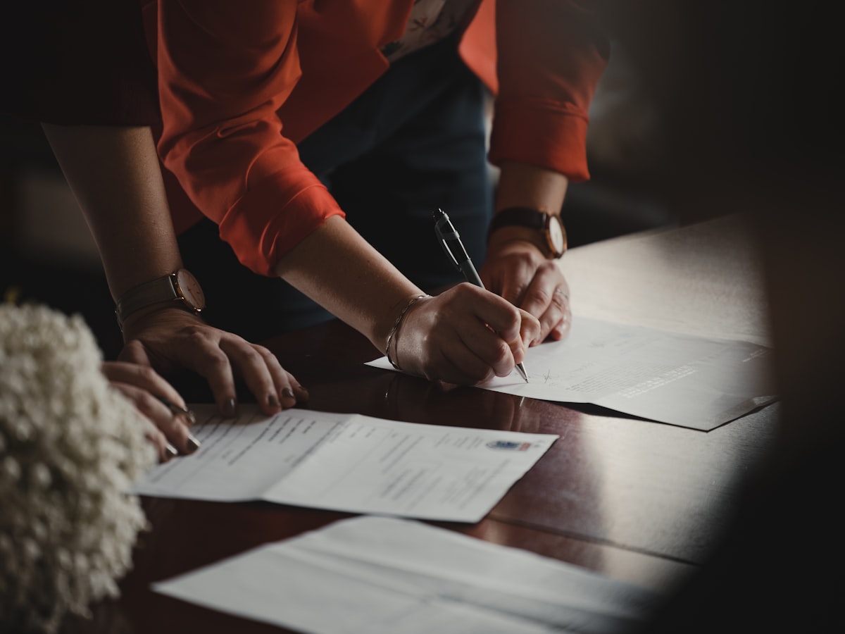 Signing a simple rental agreement at the counter